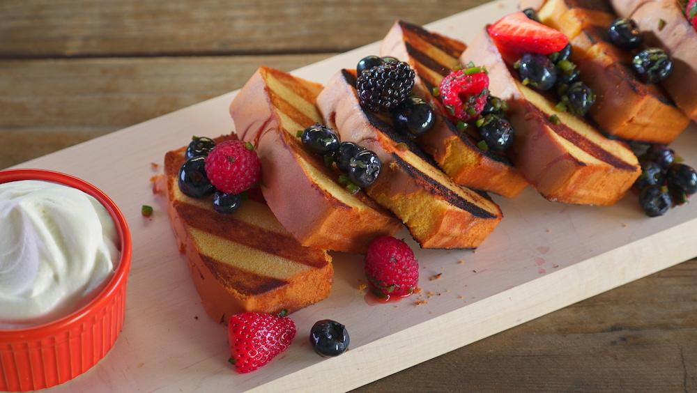 Slices of grilled poundcake with berry salsa