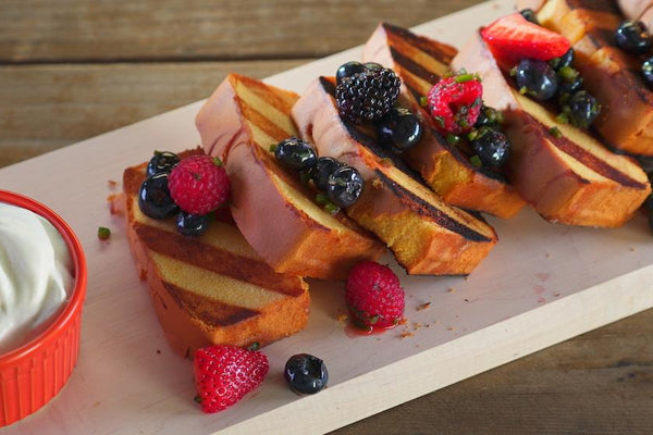 Slices of grilled poundcake with berry salsa