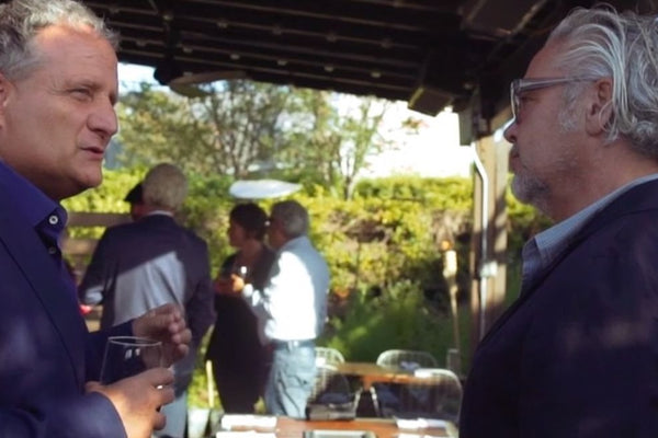 Men Standing Around Outside BBQ Grill