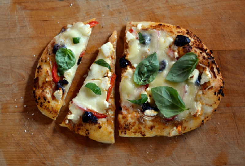 Pizza Grilled on Outdoor BBQ Grill