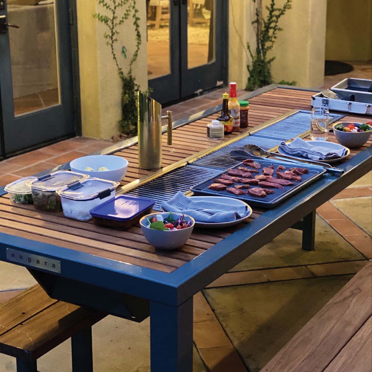 Angara outdoor dining table with grill